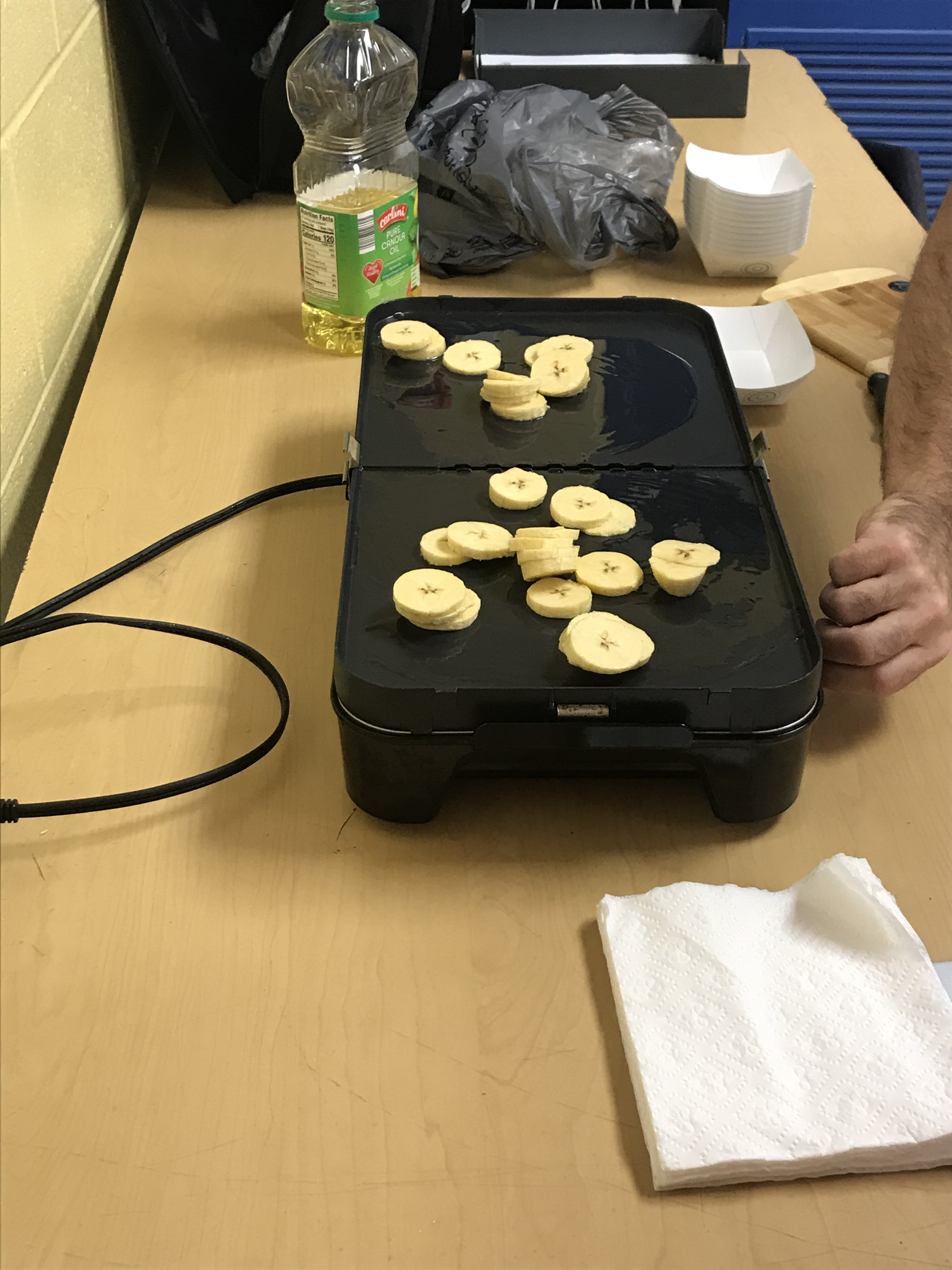SeÃ±or profe Madrigal cooking the spanish class plantains.